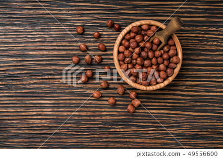 hazelnut on a brown wooden table,top view hazelnut on a brown wooden table,top view 49556600
