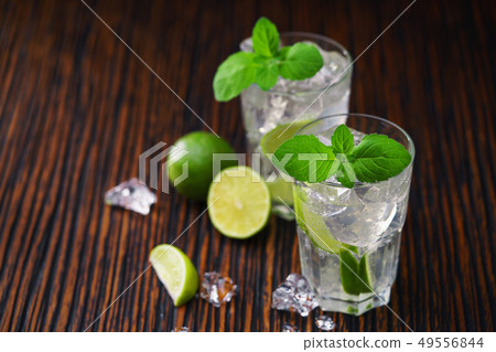 two glasses with non-alcoholic mojito cocktail two glasses with non-alcoholic mojito cocktail 49556844