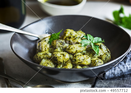 Gnocchi in Pesto sauce 49557712