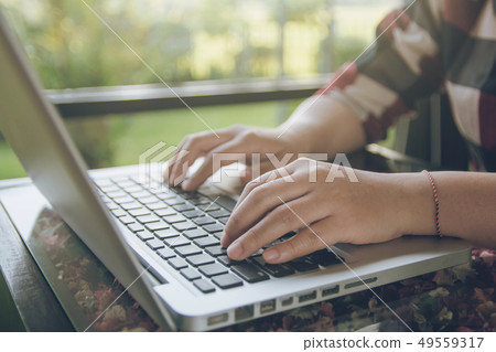 Woman working on laptop. Close up hand Woman working on laptop. Close up hand 49559317