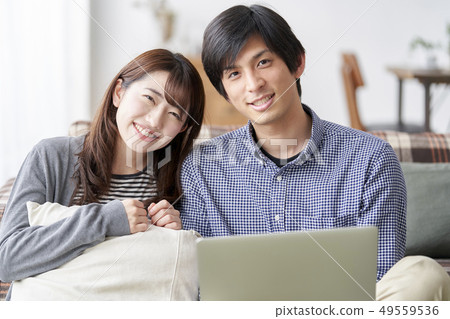 Couple looking at pc 49559536
