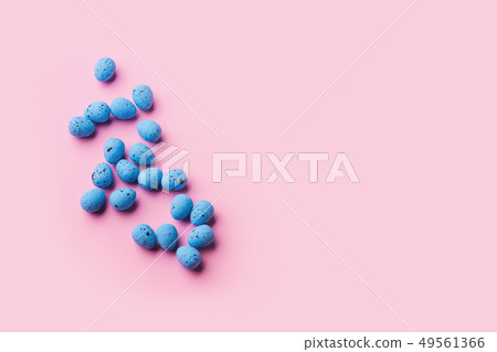 Blue decor easter eggs on pink background Blue decor easter eggs on pink background 49561366