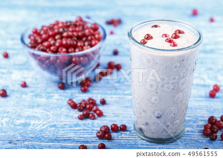 yogurt with cranberries on the table 49561555