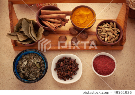 Spices and herbs on table. 49561926
