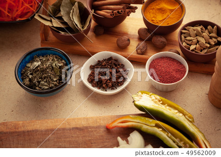 Spices and herbs on table. 49562009