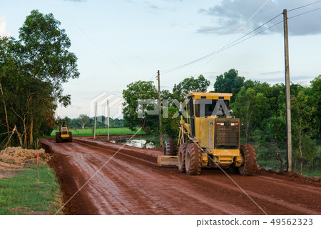 Yellow motor grader Road working on road  49562323