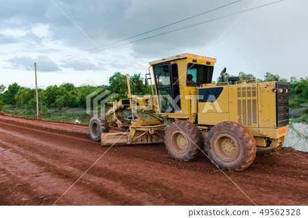 Yellow motor grader Road working on road Yellow motor grader Road working on road 49562328