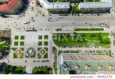 Aerial city view with crossroads and roads, houses buildings. Copter shot. Panoramic image. 49562370
