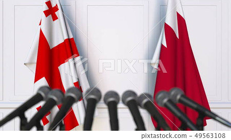 Flags of Georgia and Bahrain at international meeting or negotiations press conference. 3D rendering 49563108