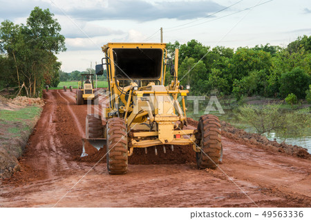 Yellow motor grader Road working  49563336