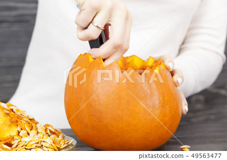 woman with pumpkins at home woman with pumpkins at home 49563477
