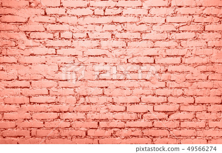 Coral pink toned brick wall background texture 49566274