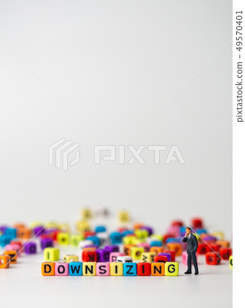 miniature figure businessman in dark blue suit 49570401