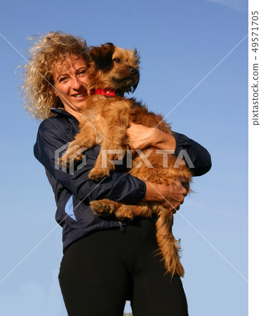 Pyrenean sheepdog and woman Pyrenean sheepdog and woman 49571705