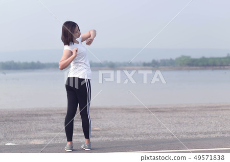 Closeup woman warm up and stretching exercises 49571838