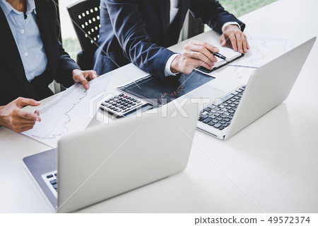 Business team investment working with computer and Business team investment working with computer and 49572374