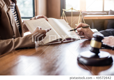 Businesswoman and Male lawyer or judge consult having team meeti 49572642
