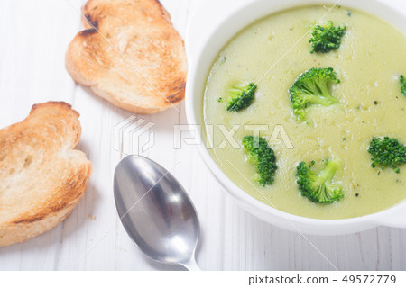Fresh broccoli cream soup in bowl Fresh broccoli cream soup in bowl 49572779