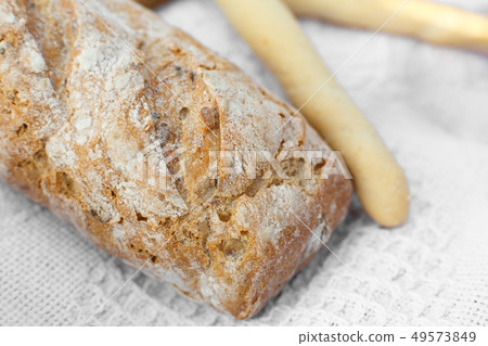 Closeup fresh baked bread on light blurred 49573849