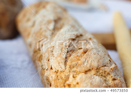 Closeup fresh baked bread on light blurred 49573850