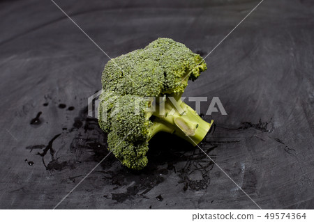Fresh green wet broccoli. 49574364