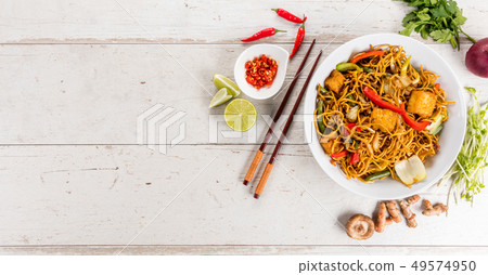 Top view composition of fried noodles with tofu Top view composition of fried noodles with tofu 49574950
