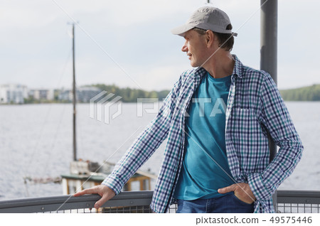 Man admires Saimaa lake in Lappeenranta 49575446