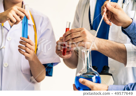 Group of scientists working in chemical lab. 49577649