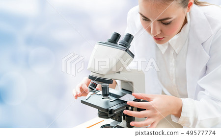 Scientist researcher uses microscope in laboratory 49577774