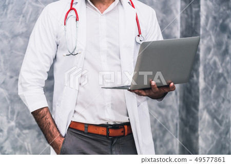 Doctor using laptop computer at the hospital. Doctor using laptop computer at the hospital. 49577861