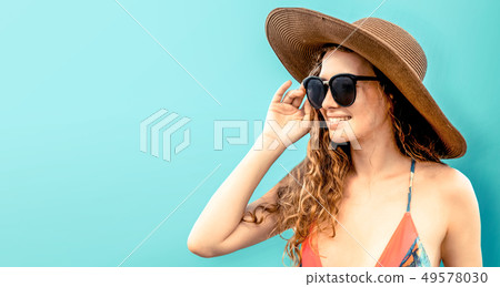 Woman in swimsuit posing on color background. 49578030