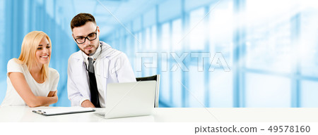 Doctor talking to patient in the hospital. 49578160