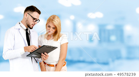 Doctor talking to patient in the hospital. 49578239