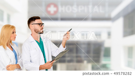 Doctors working with colleague in the hospital. Doctors working with colleague in the hospital. 49578282