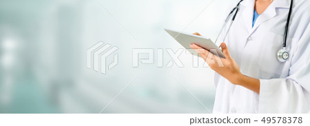 Doctor using tablet computer at the hospital. Doctor using tablet computer at the hospital. 49578378