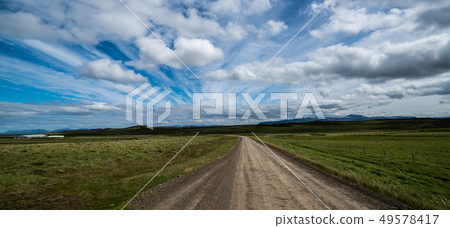 Empty dirt road through countryside landscape. Empty dirt road through countryside landscape. 49578417
