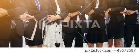 Many happy business people holding hands together. 49578597