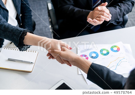 Business people handshake agreement in office. Business people handshake agreement in office. 49578764