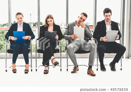 Businesswomen and businessmen wait for interview. Businesswomen and businessmen wait for interview. 49578839