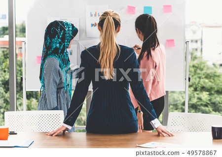 Multicultural working group in teamwork meeting. 49578867