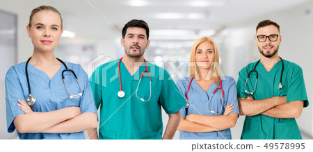 Doctor working in hospital with other doctors. 49578995