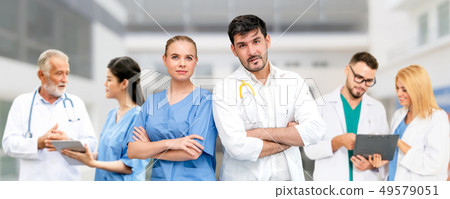 Doctor working in hospital with other doctors. Doctor working in hospital with other doctors. 49579051