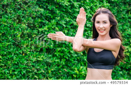 Young sport woman doing morning exercise in park. 49579334