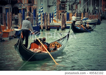 Gondola in canal in Venice 49582102