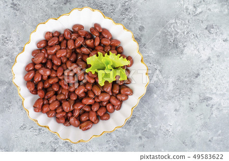 Red canned beans in white plate on gray background Red canned beans in white plate on gray background 49583622