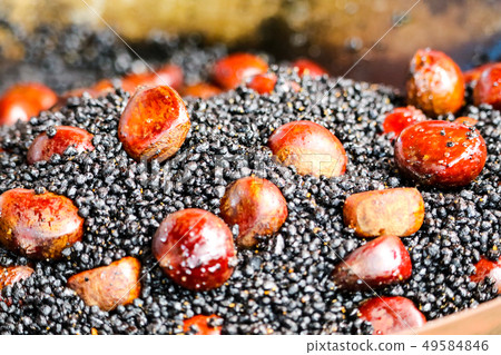 Hot roasted chestnuts on stove and good smell of Hot roasted chestnuts on stove and good smell of 49584846