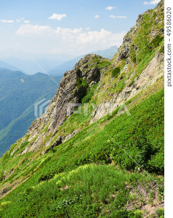 The rock on a high mountain slope. 49586020
