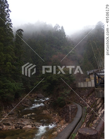 Landscape of misty Asahara mountain stream 49586179