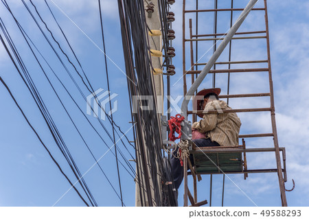 Working to install electric line Working to install electric line 49588293