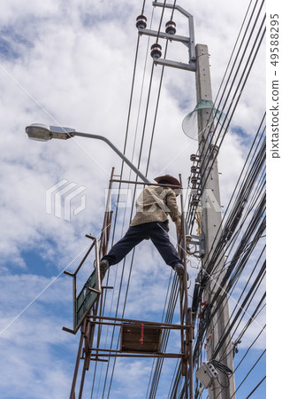 Working to install electric line Working to install electric line 49588295